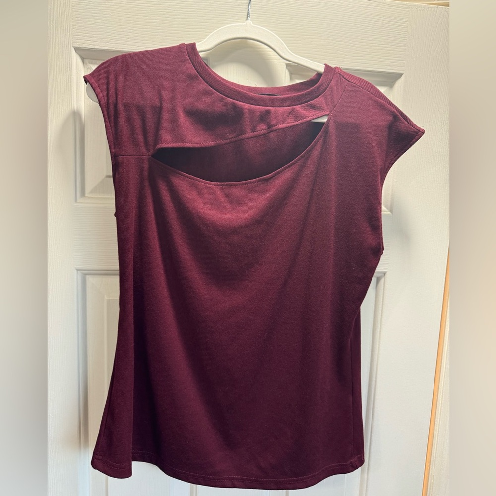 2 sleeveless tops with picaboo slit
